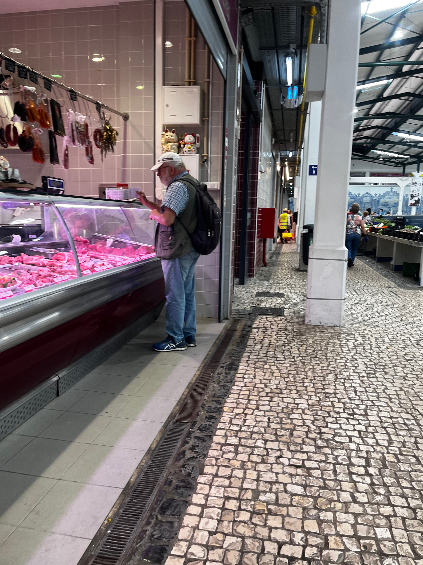 Man at meat counter in Setúbal market