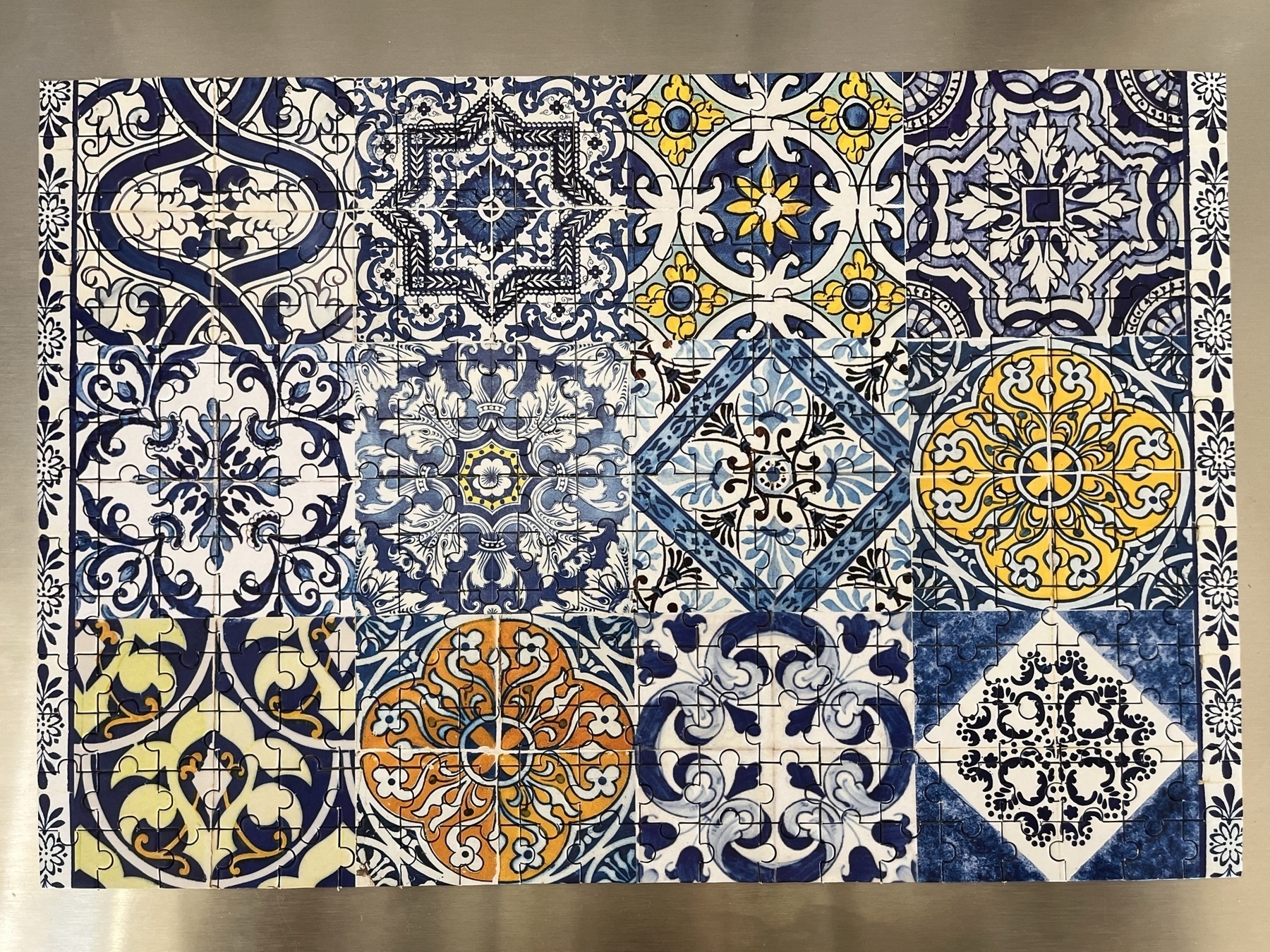 A completed 280 piece jigsaw puzzle of Portuguese tiles