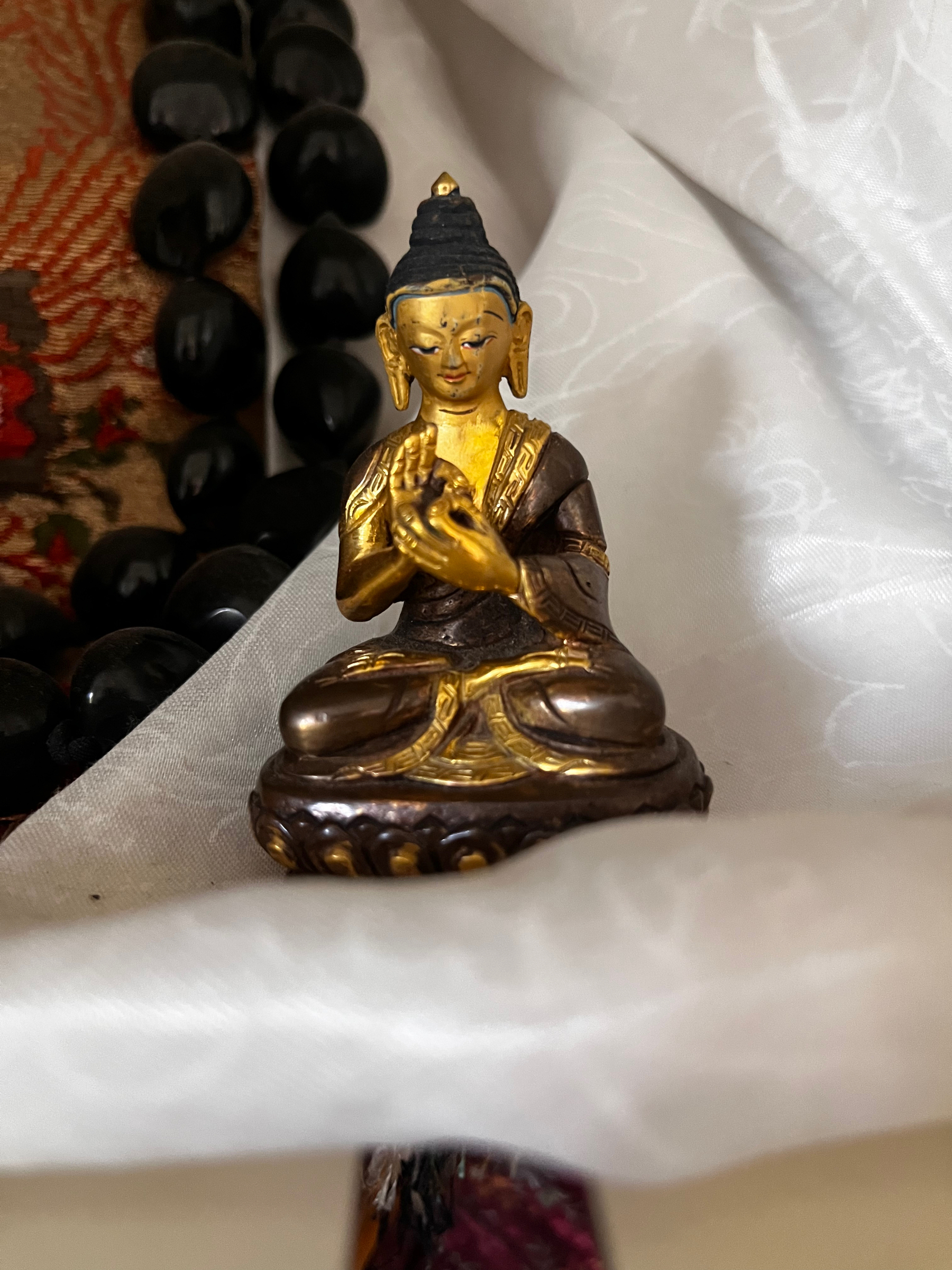 A small Buddha statue or rupa