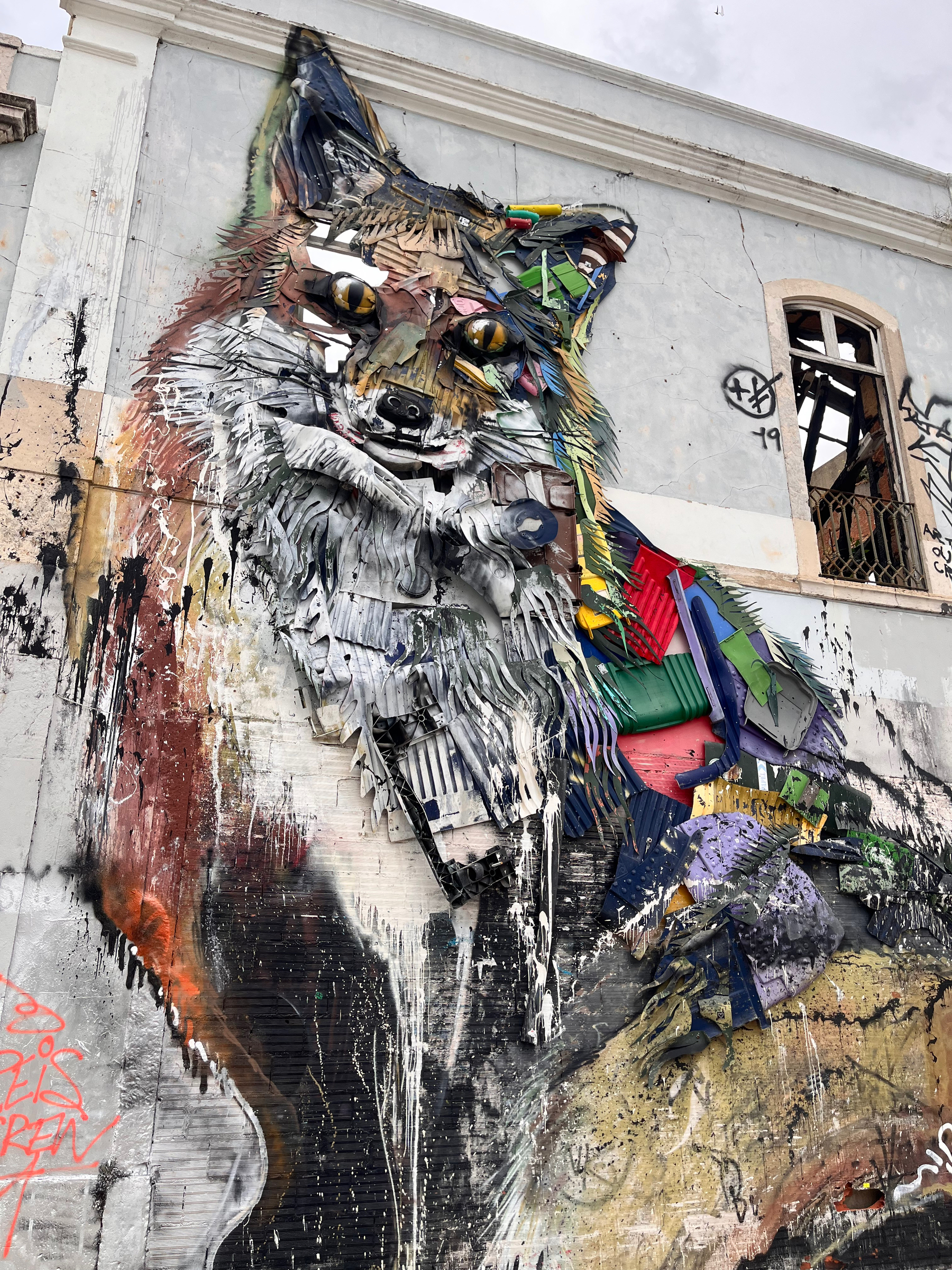 A very large mural of a dog, on a wall in Lisbon