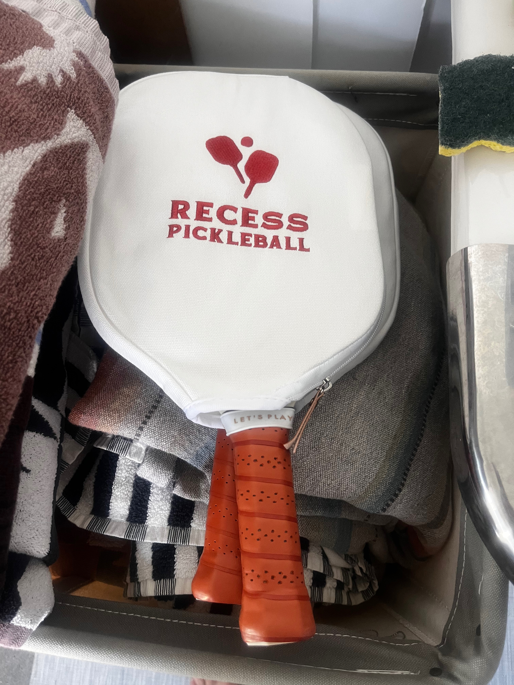 Pickle ball rackets in their covers sitting at home