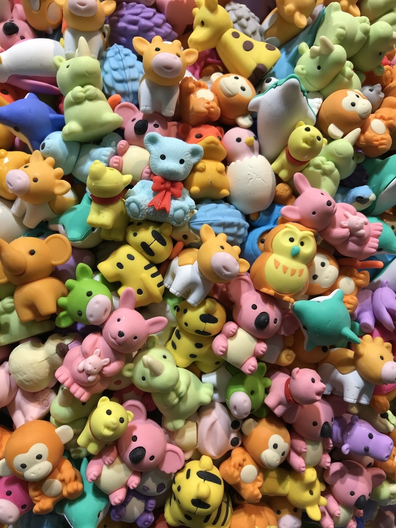 Lots and lots of little plastic animals, close up, as part of an art exhibit